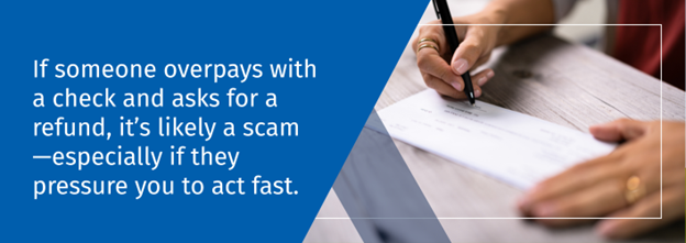 Hands writing a blank check